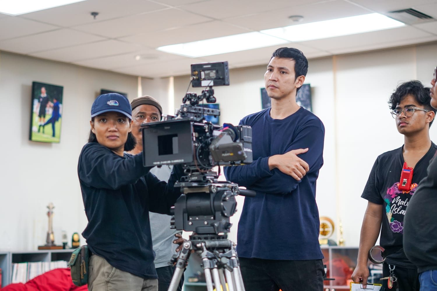 Temporary behind-the-scenes photograph of a camera on set. This is a sample image and does not depict the director.